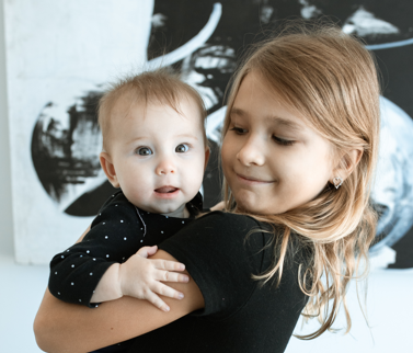 My Older Child Isn't Bonding With Her Baby Sibling, How Do I Encourage Her to Care?