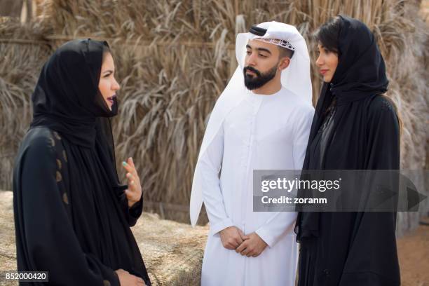 Young Arab women making selfie, standing next to each other