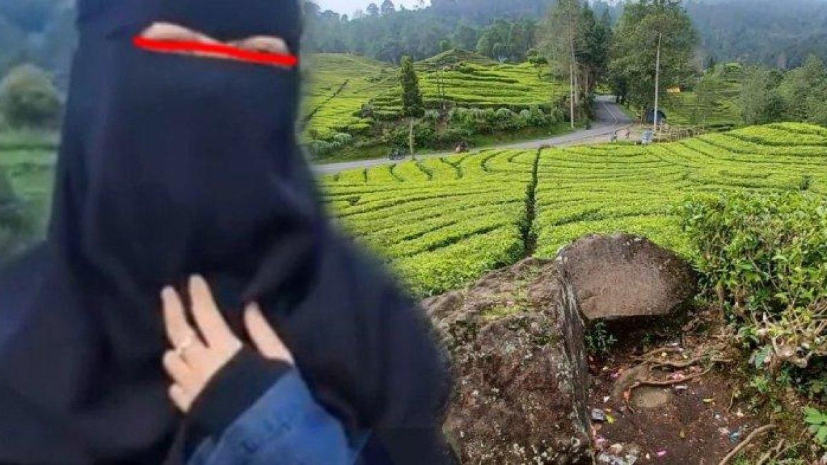 Wanita cadar kencing di kebun teh